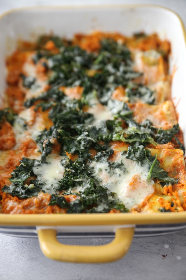 kale lasagna with cheese right out of oven