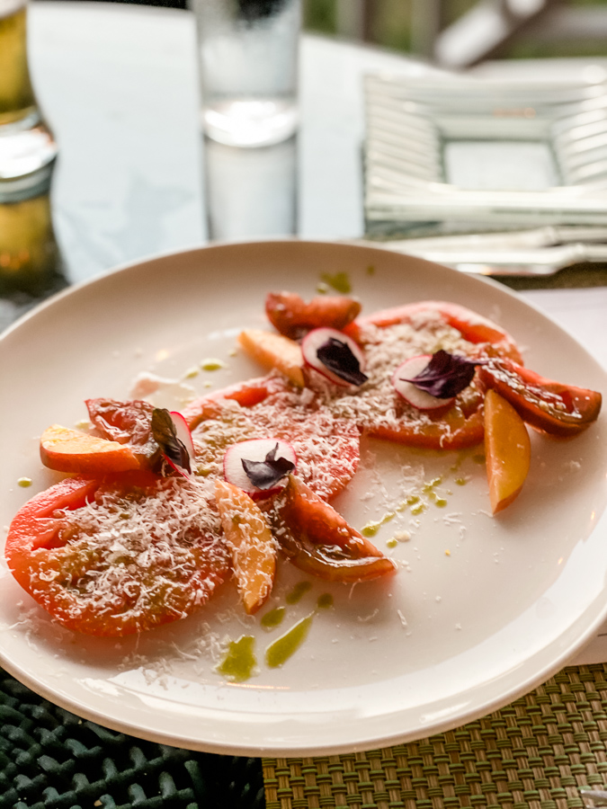 Heirloom tomatoes with peaches, basil oil, and parmesan 