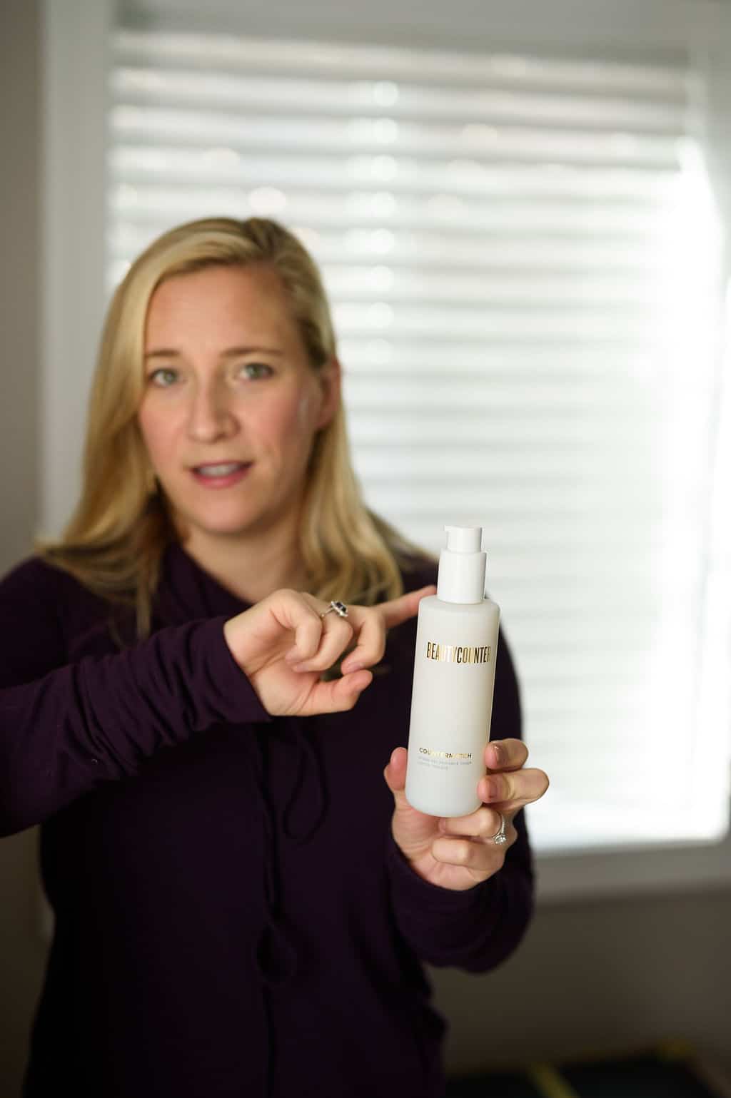 Kath pointing to the Beautycounter Countermatch toner