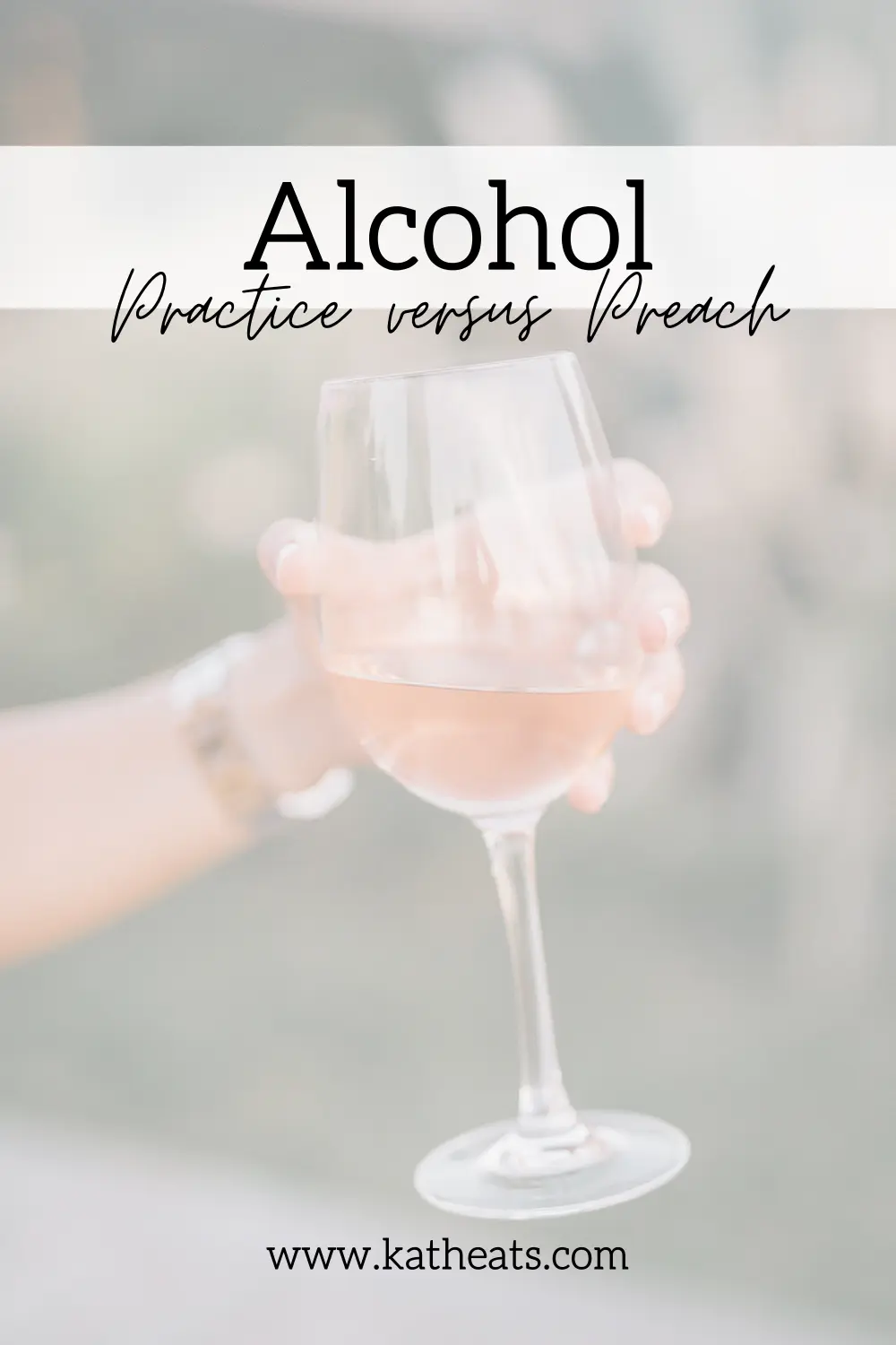Hand holding a glass of white wine with text overlay.
