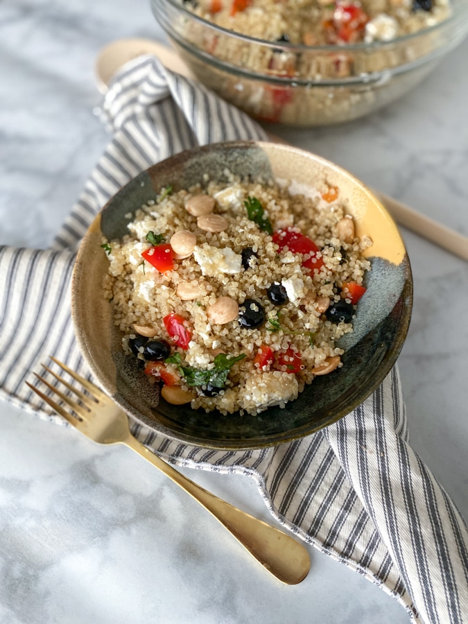 quinoa salad with gold fork and napkin