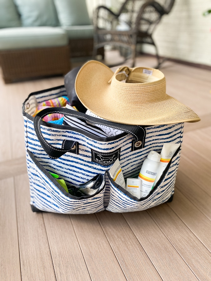 close up of Scout BJ bag packed for the pool with a sun hat on top