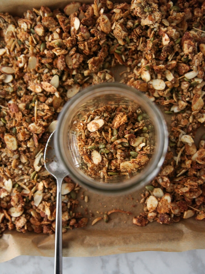 granola in a jar on a baking sheet