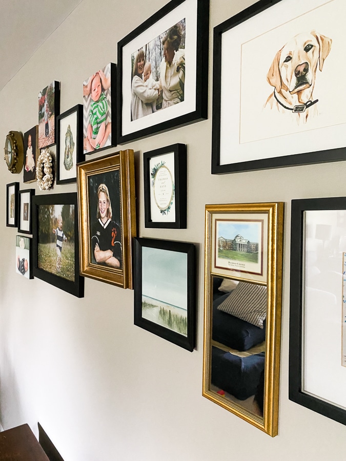 gold mirrors and frames in a gallery wall