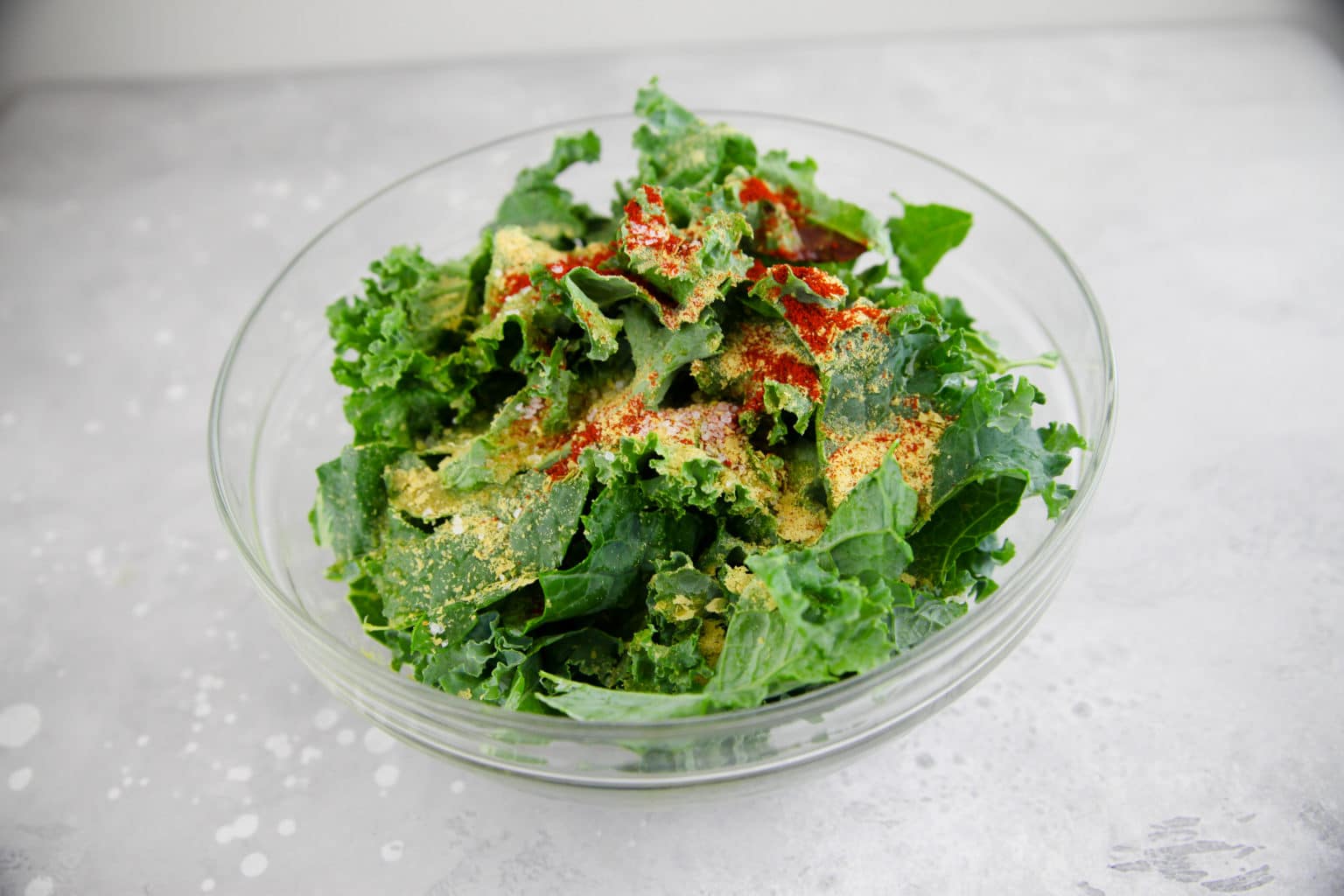 bowl of kale with seasonings