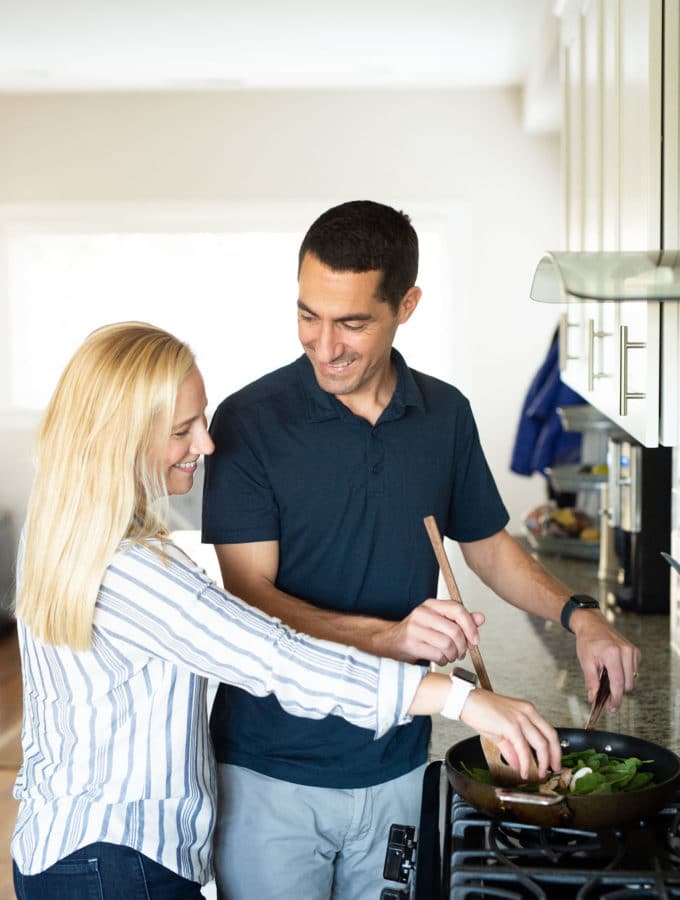kath adds mushrooms to cooking spinach