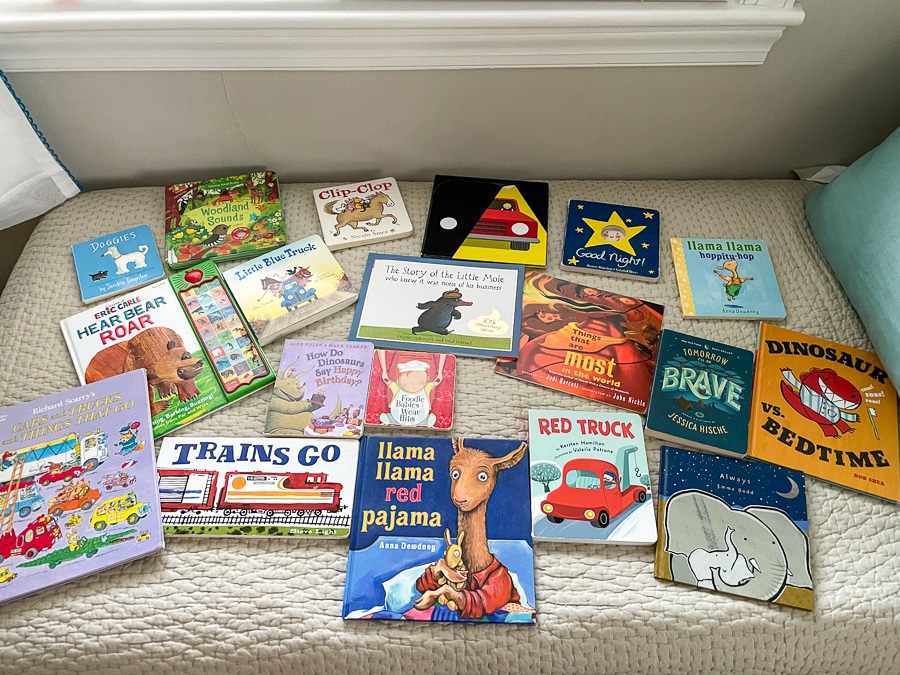 kids books spread out on a bed
