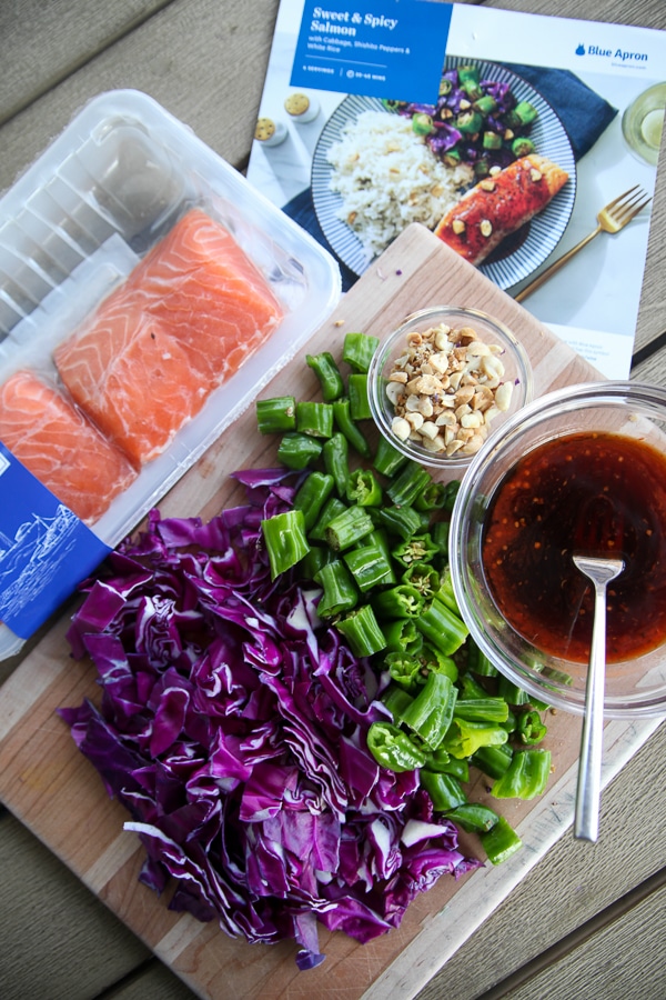 a cutting board of fresh blue apron ingredients
