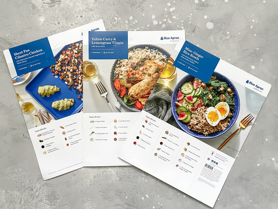 Blue Apron recipe cards on a gray background