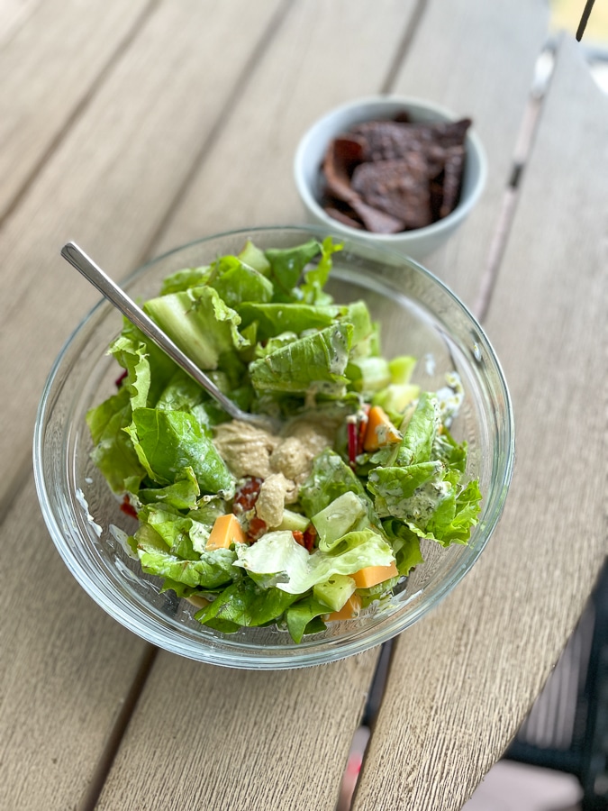 green salad in clear bowl