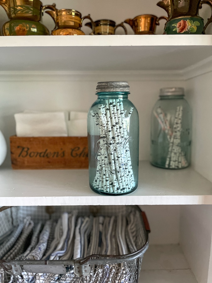 vintage blue mason jar with straws inside