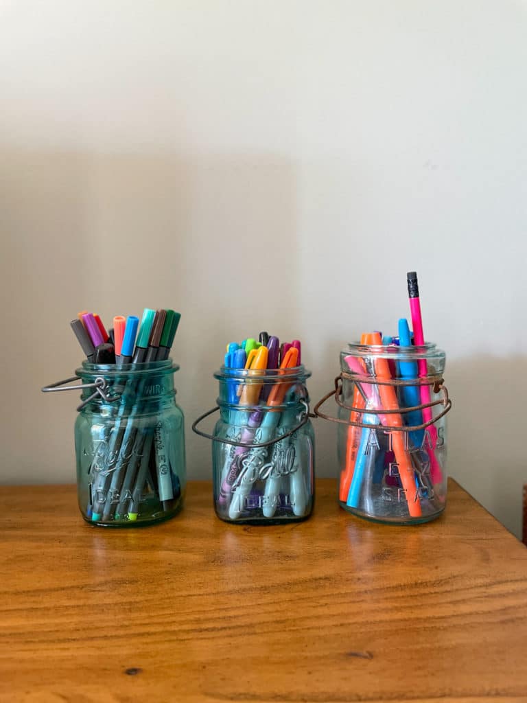 colorful pens in vintage mason jars | 20 Empty Mason Jar Storage Ideas