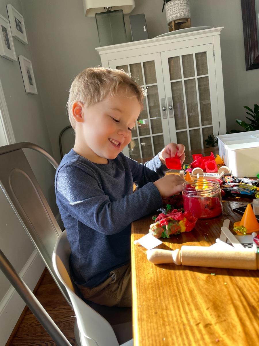 toddler playing at table | How To Raise Happy Kids In The Digital Age