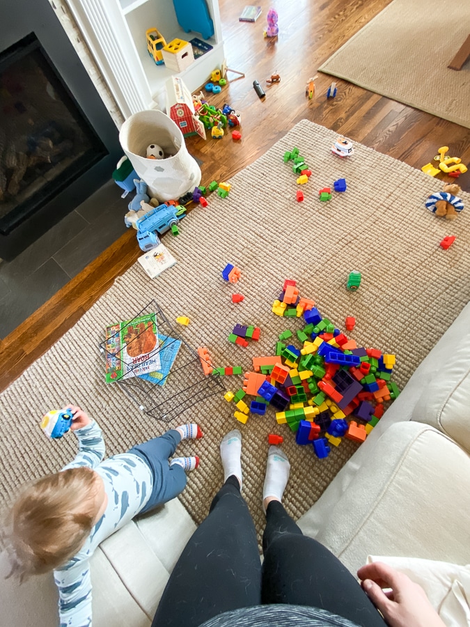 toddler in a room of toys