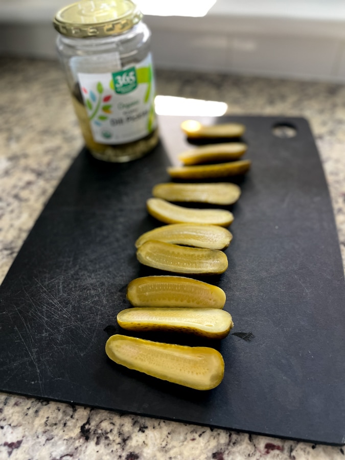 a line of sliced pickles
