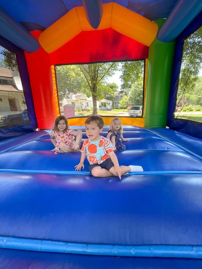 Cousins playing in bounce house