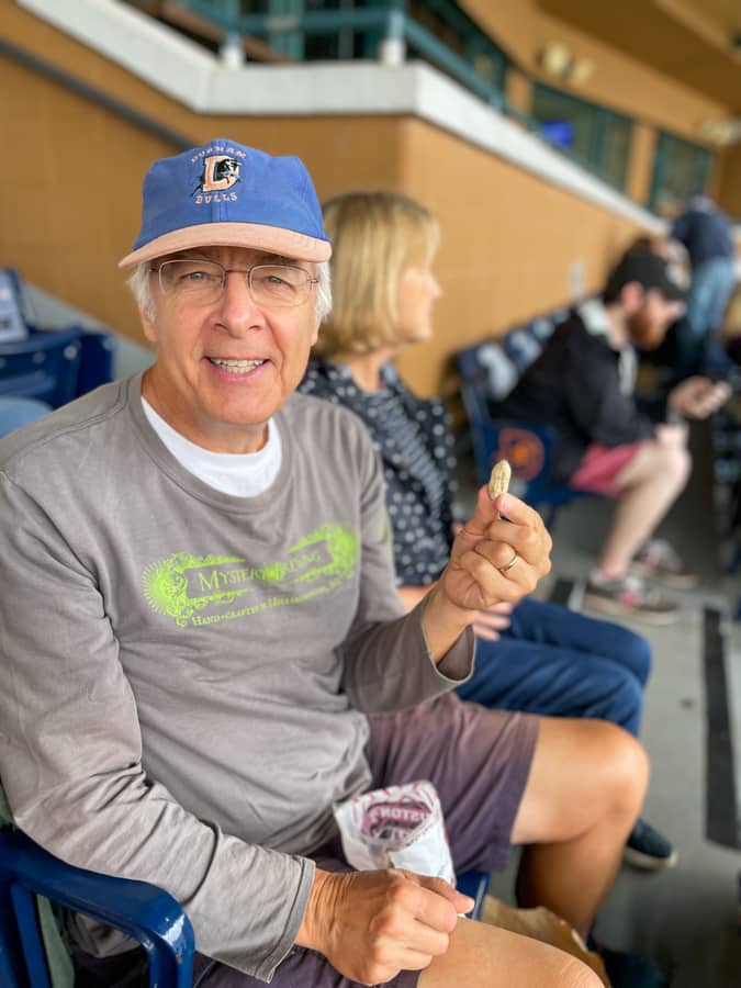 gramps eating peanuts during baseball game