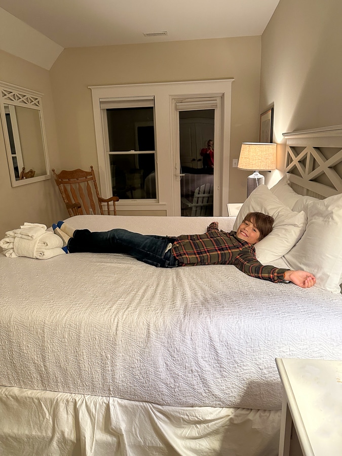child in king bed