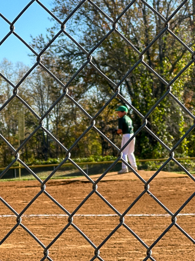 out of focus boy playing baseball