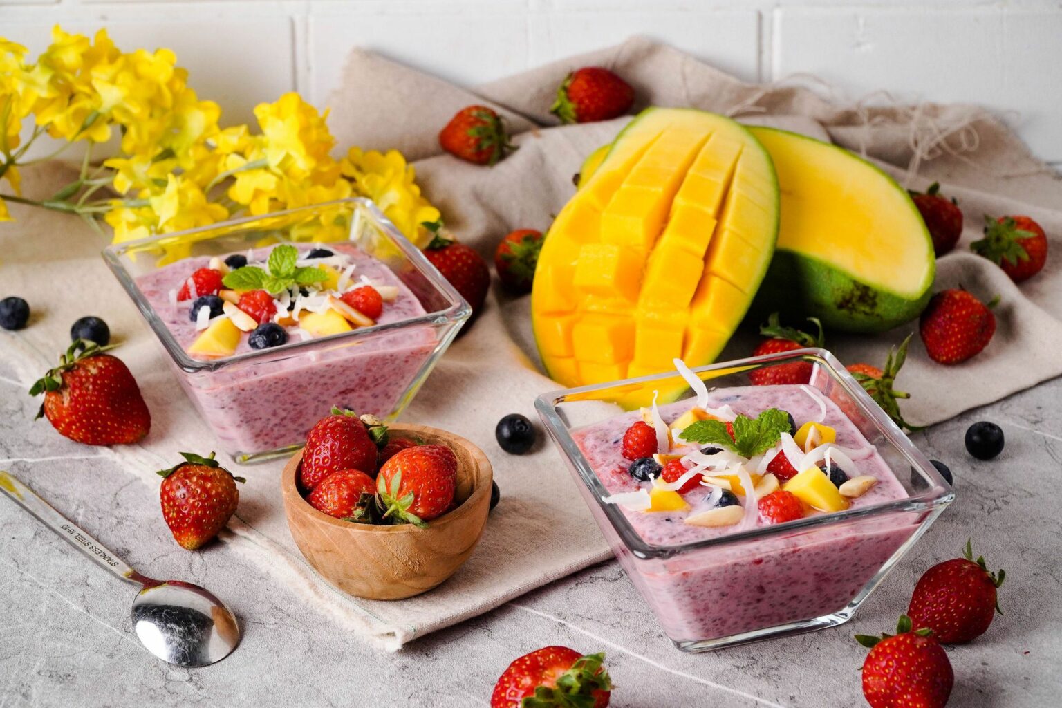 Chia Pudding Bowl with fruit toppings Chia Pudding Breakfast Bowl with fresh berries and mango