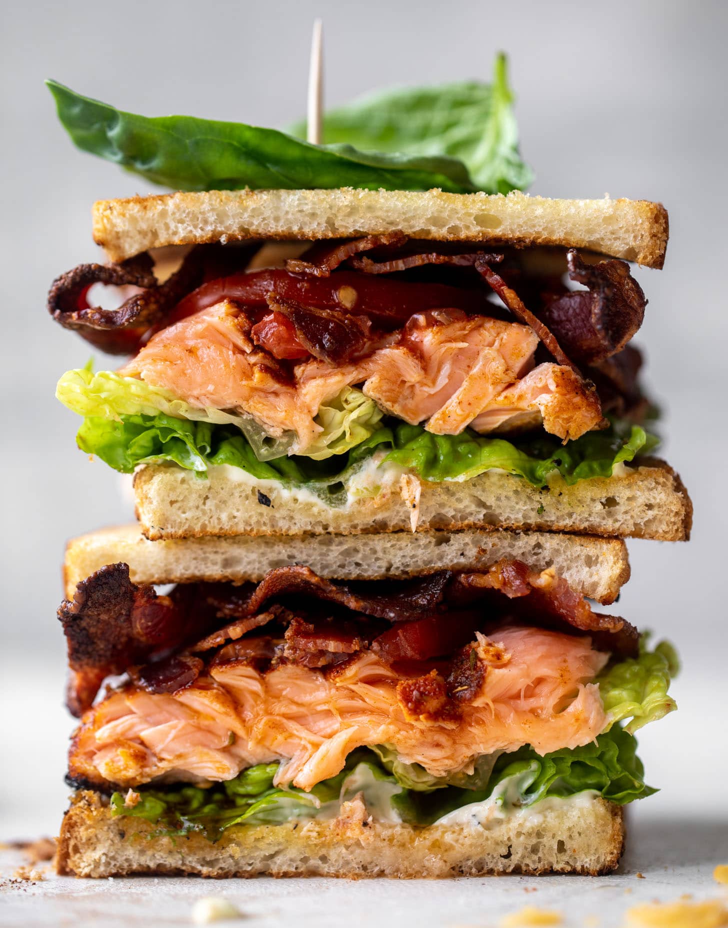 Delicious Sandwich Recipes: Grilled Salmon Club Sandwich with Charred Scallion Mayo