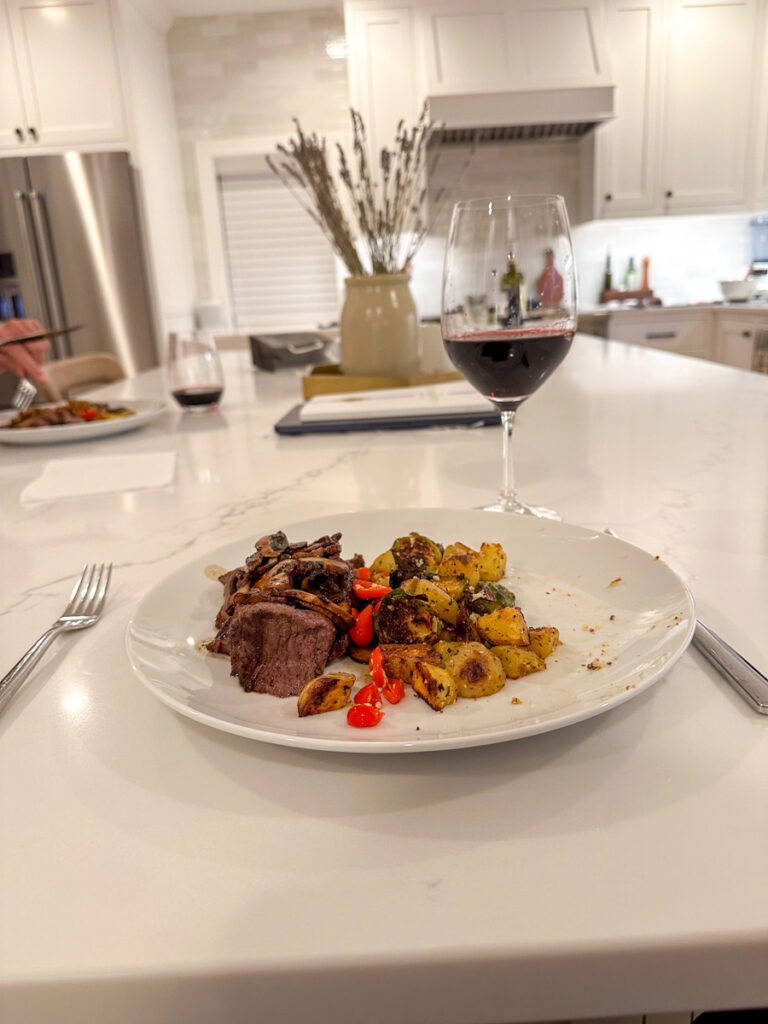 Steak with roasted potatoes and red wine