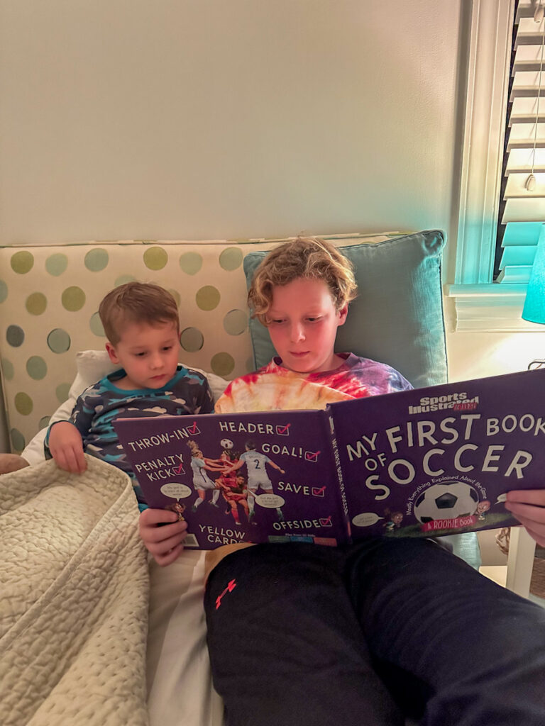 cousins reading a book