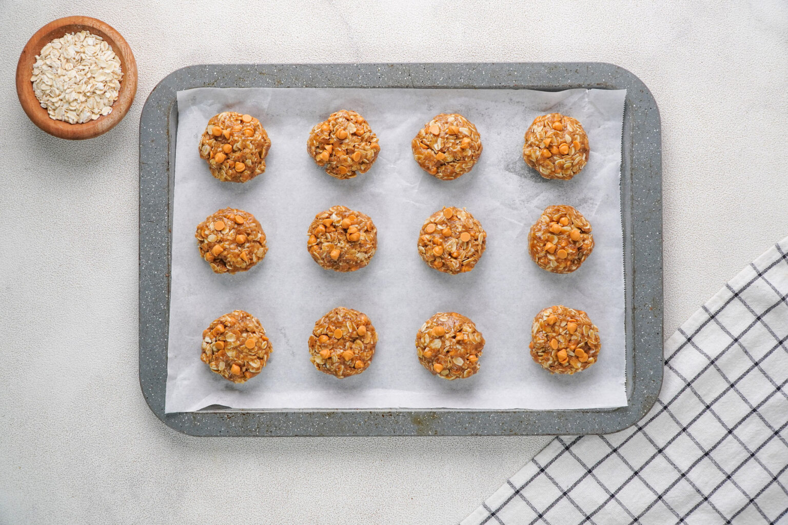 Portion cookie dough on baking sheet