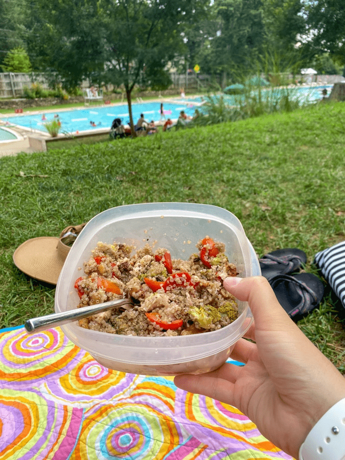 hot honey quinoa salad in a tupperware at the pool. It's an easy light dinner recipe for busy weeknights