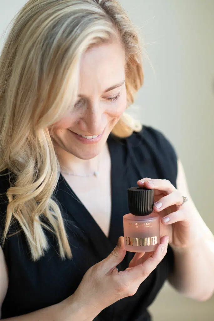 Kath Eats Blogger Kath Younger shares Beautycounter Sale - in photo: Kath holding a product from Beautycounter Kath Eats Blogger Kath Younger shares Beautycounter Sale - in photo: Kath holding a product from Beautycounter