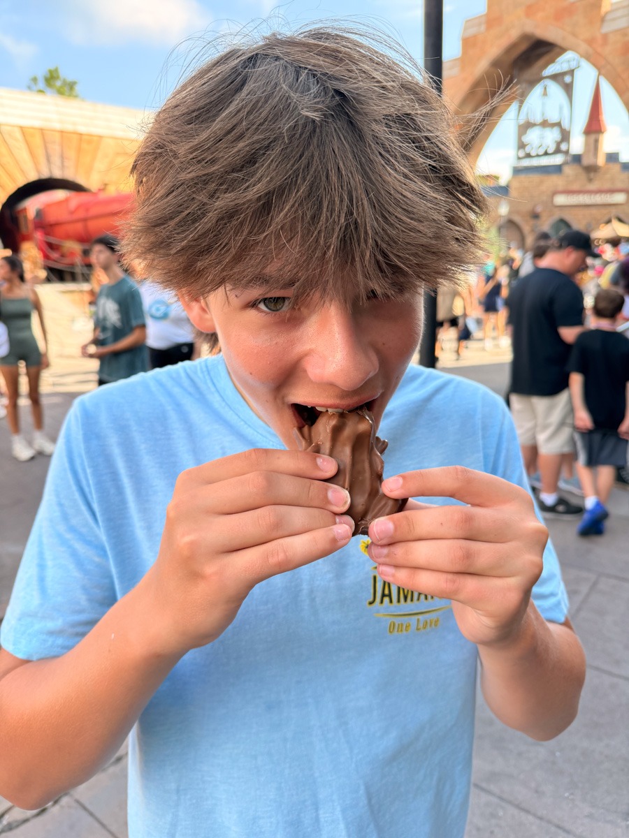 Mazen eating a chocolate frog