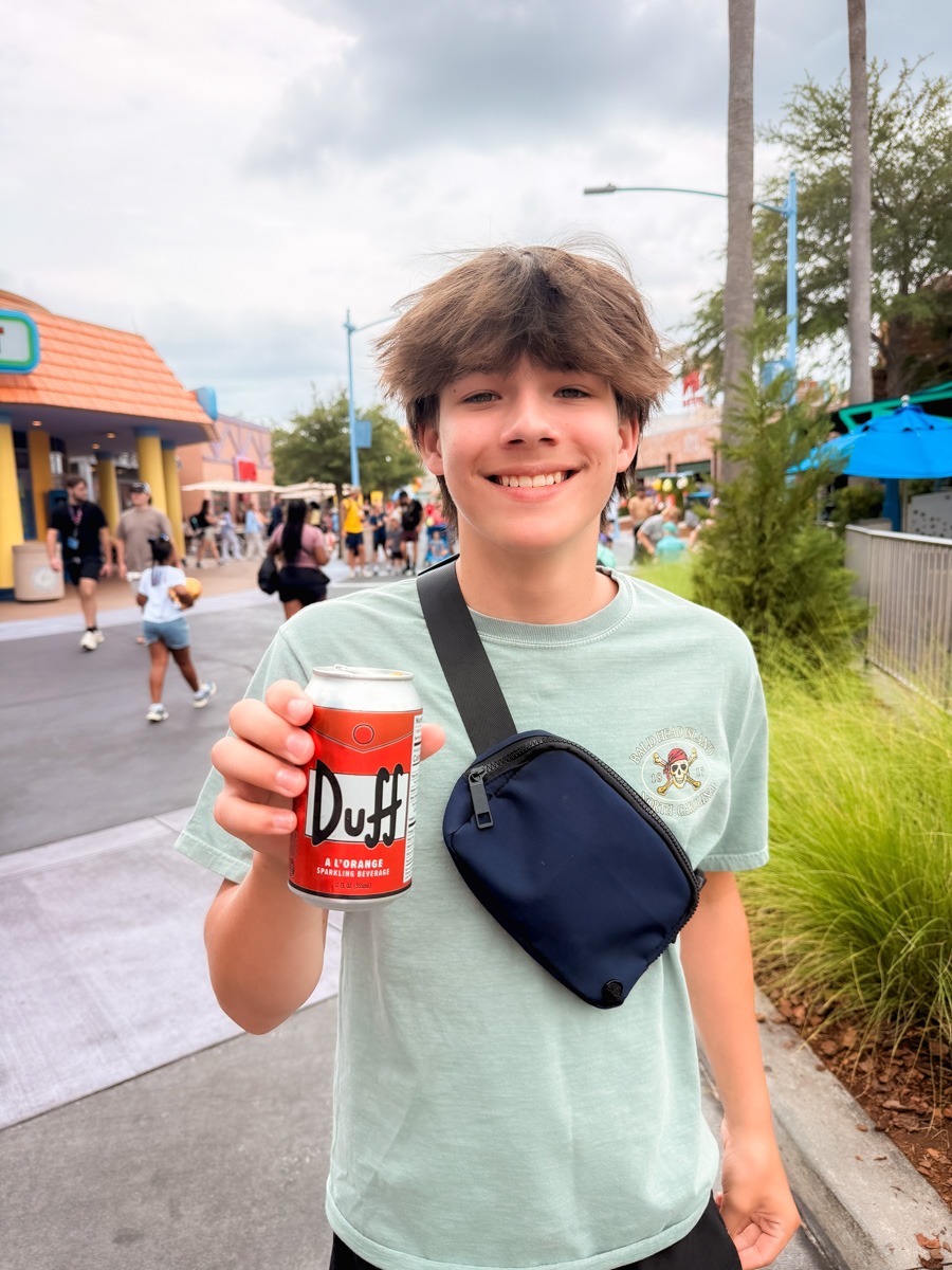Teen holding Duff drink
