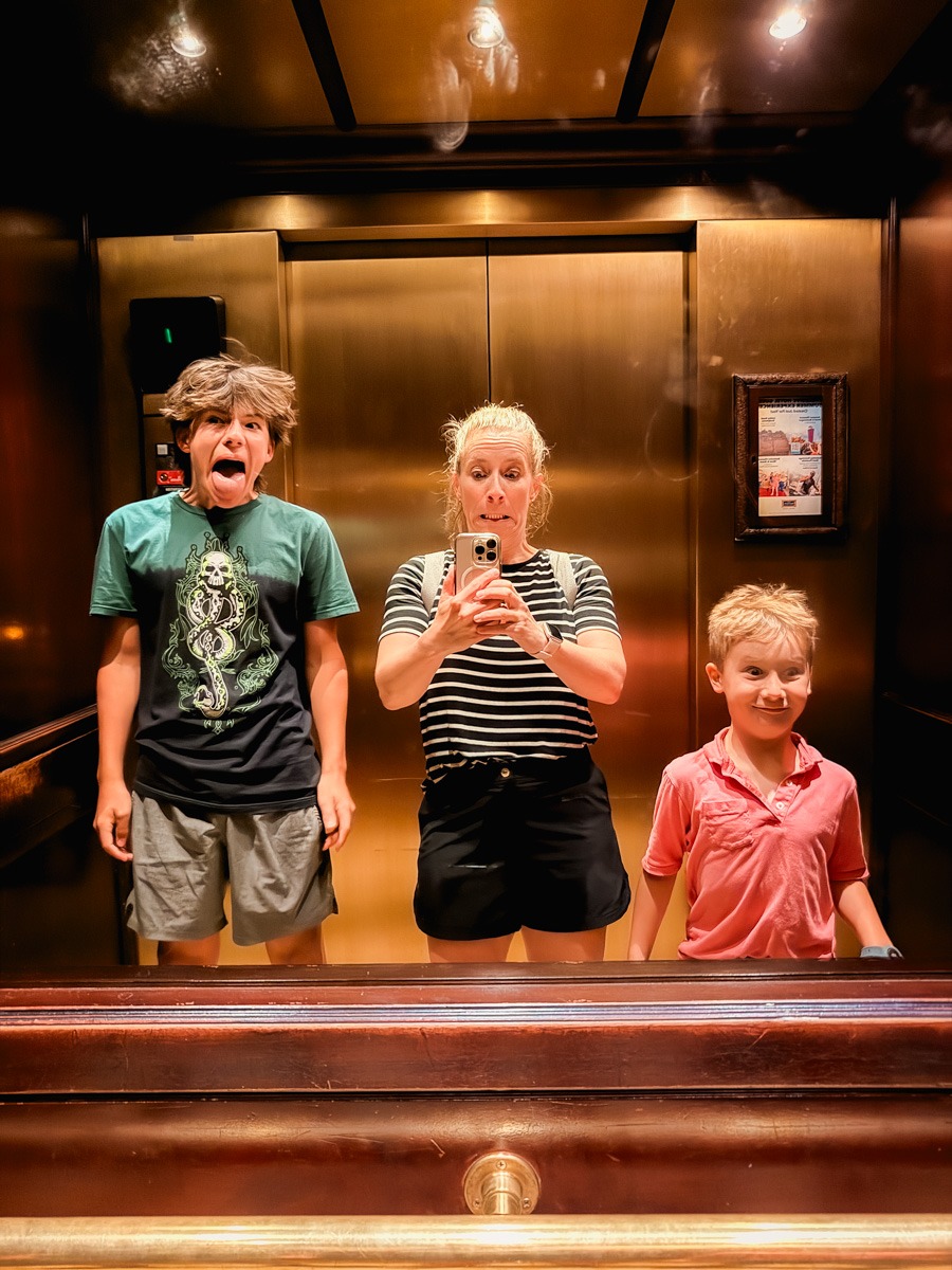 Youngers in elevator making faces