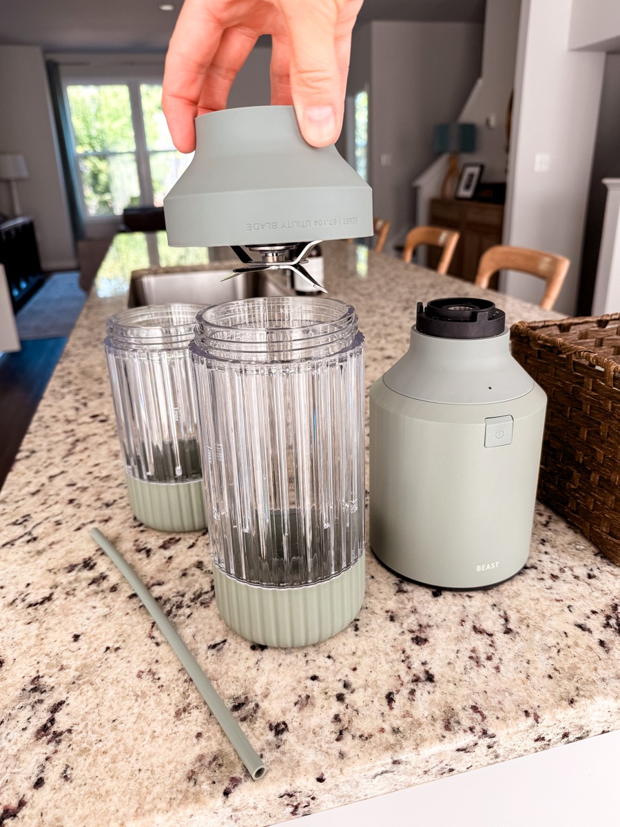 beast blender with the blade hovering above by a hand